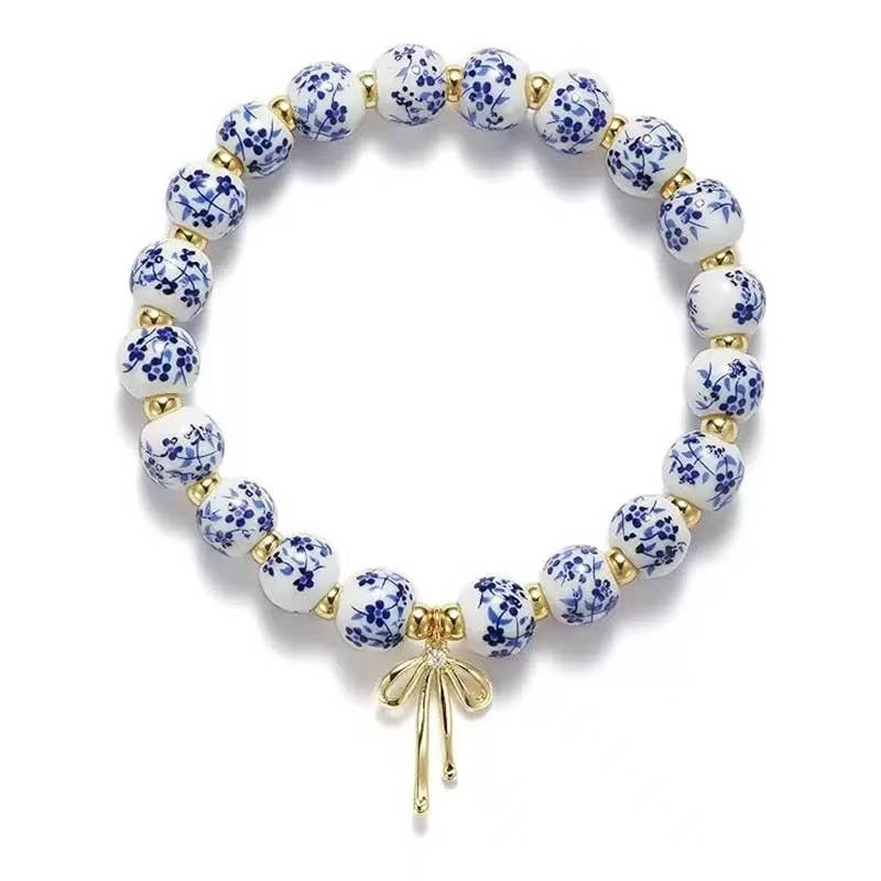 Chinoiserie Charm Bracelet with Gold Bow – Classic Elegance