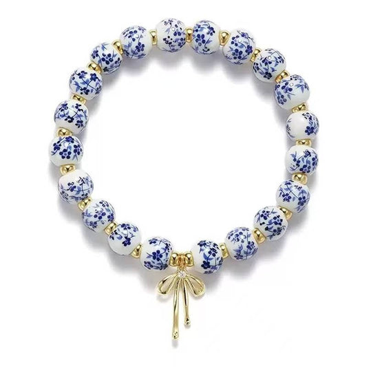 Chinoiserie Charm Bracelet with Gold Bow – Classic Elegance